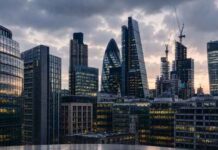 UK commercial property sector faces valuation pressure from energy standards London commercial real estate skyline showcasing modern office buildings under energy efficiency valuation pressure.